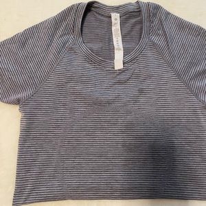 Lululemon grey, white, & black stripe swiftly with 2 small spots. Size : 4